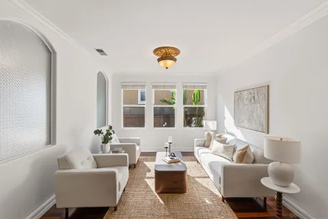 a living room with furniture and a window