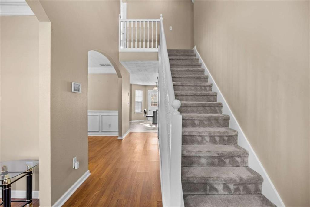 100 Adelaide Drive Covington, GA 30016 - Photo 15 of 33 a view of entryway and hall with wooden floor