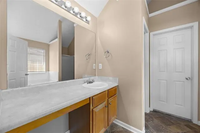 a view of a hallway to a bedroom