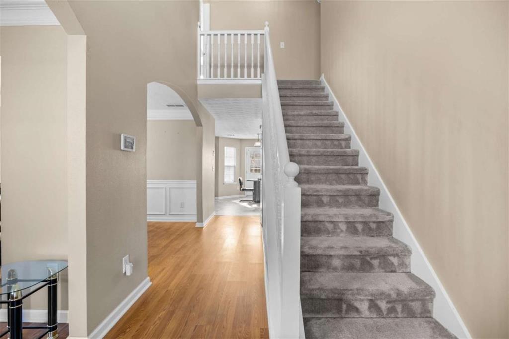 100 Adelaide Drive Covington, GA 30016 - Photo 3 of 33 a view of entryway and hall with wooden floor