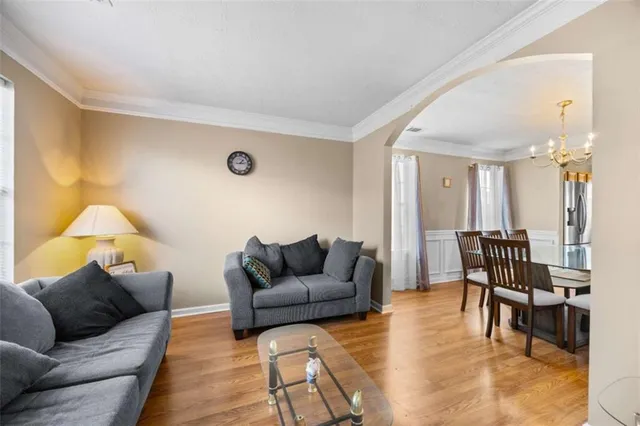 a living room with furniture and a table