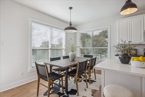 a view of a dining room with furniture window and outside view