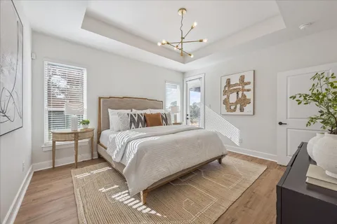 a bedroom with a large bed and a window