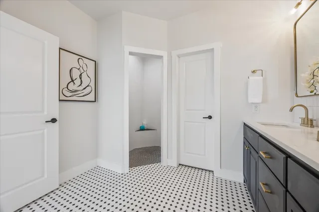 a bathroom with a sink and a mirror