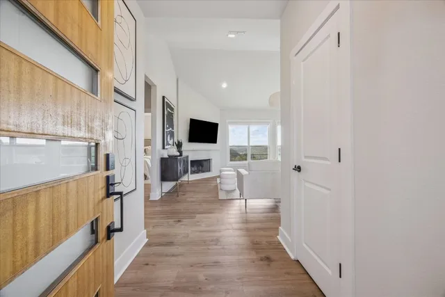 a view of a kitchen with wooden floor and a sink