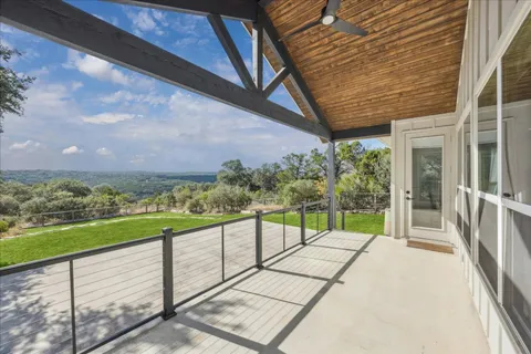 a view of a balcony with ocean view