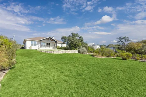 a view of a house with a big yard