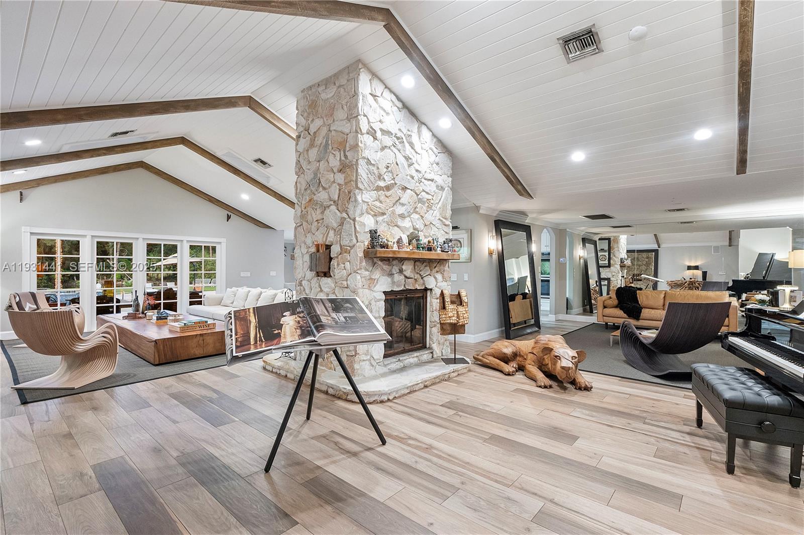 8020 Northwest 47th Drive Coral Springs, FL 33067 - Photo 27 of 83 a living room with fireplace furniture and a large window