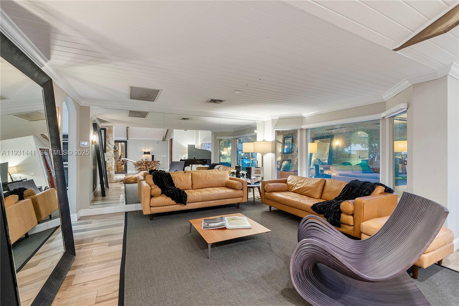 8020 Northwest 47th Drive Coral Springs, FL 33067 - Photo 30 of 83 a living room with furniture and a flat screen tv