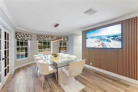 a spacious bathroom with double vanity and a shower