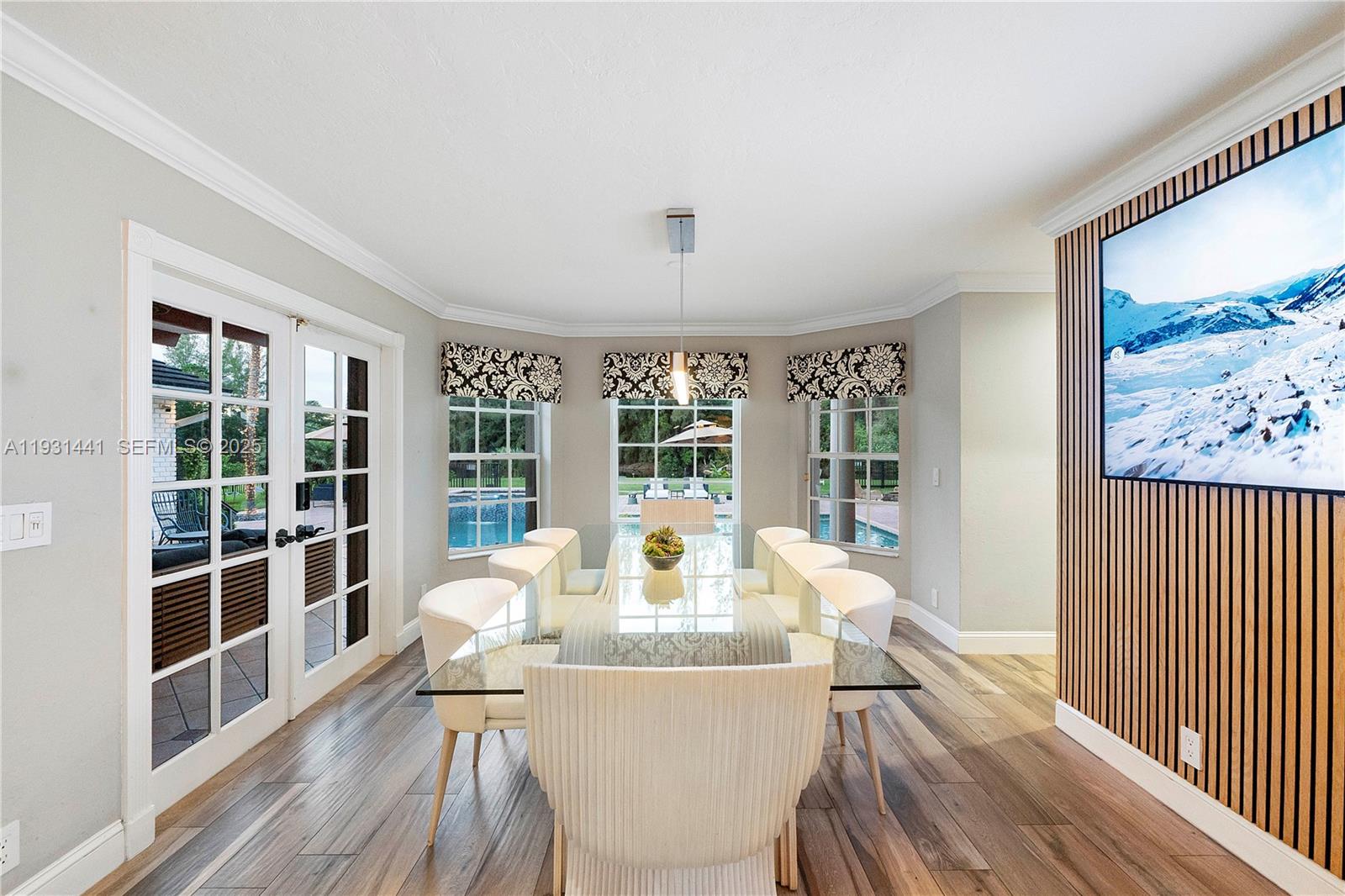 8020 Northwest 47th Drive Coral Springs, FL 33067 - Photo 32 of 83 a view of a dining room with furniture window and wooden floor
