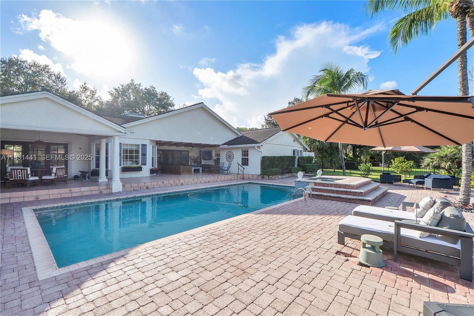 8020 Northwest 47th Drive Coral Springs, FL 33067 - Photo 34 of 83 a view of a house with swimming pool and sitting area