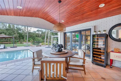a bathroom with a granite countertop sink mirror and shower