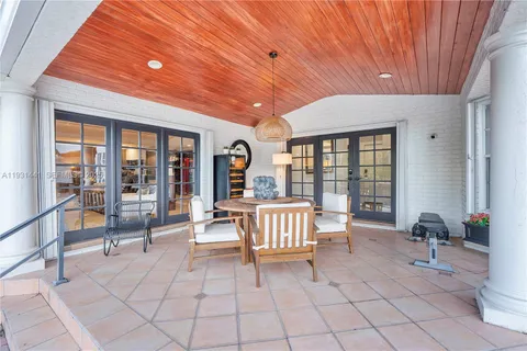 a living room with lots of furniture and a book shelf