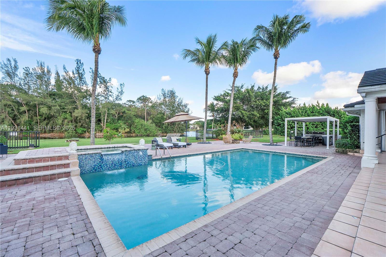 8020 Northwest 47th Drive Coral Springs, FL 33067 - Photo 45 of 83 a view of swimming pool with a patio