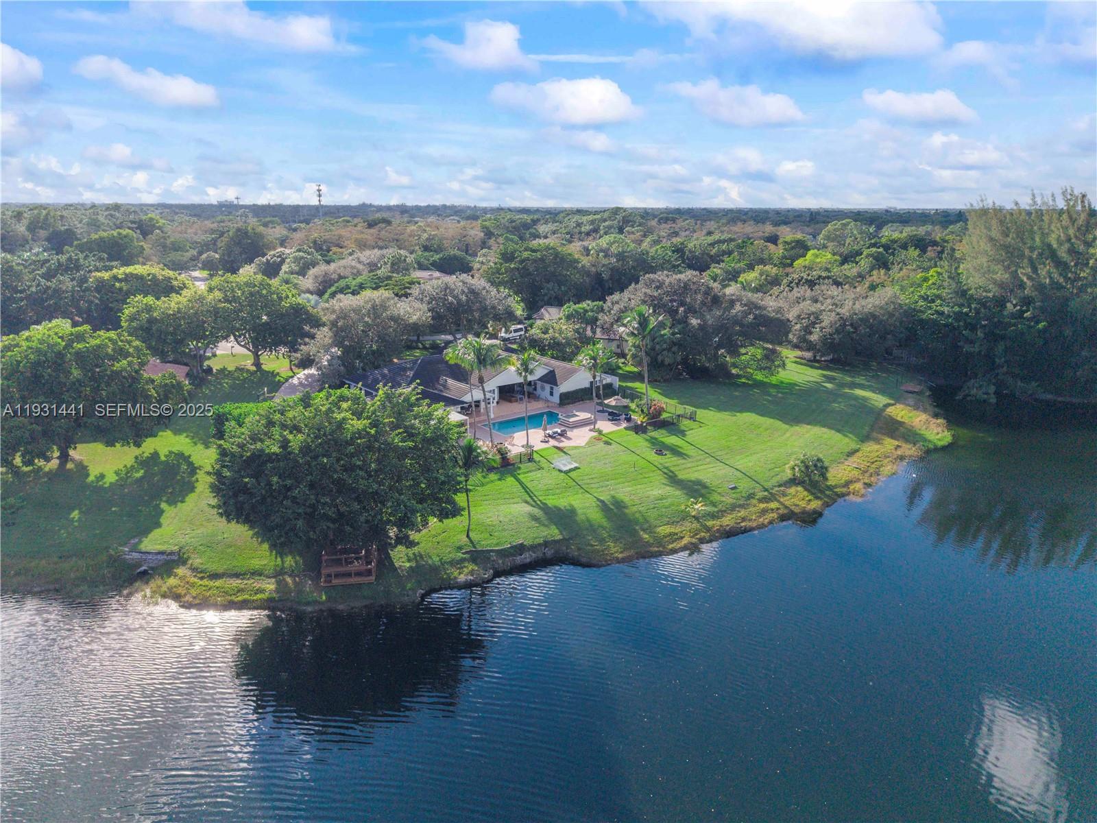 8020 Northwest 47th Drive Coral Springs, FL 33067 - Photo 5 of 83 a view of a lake with a yard