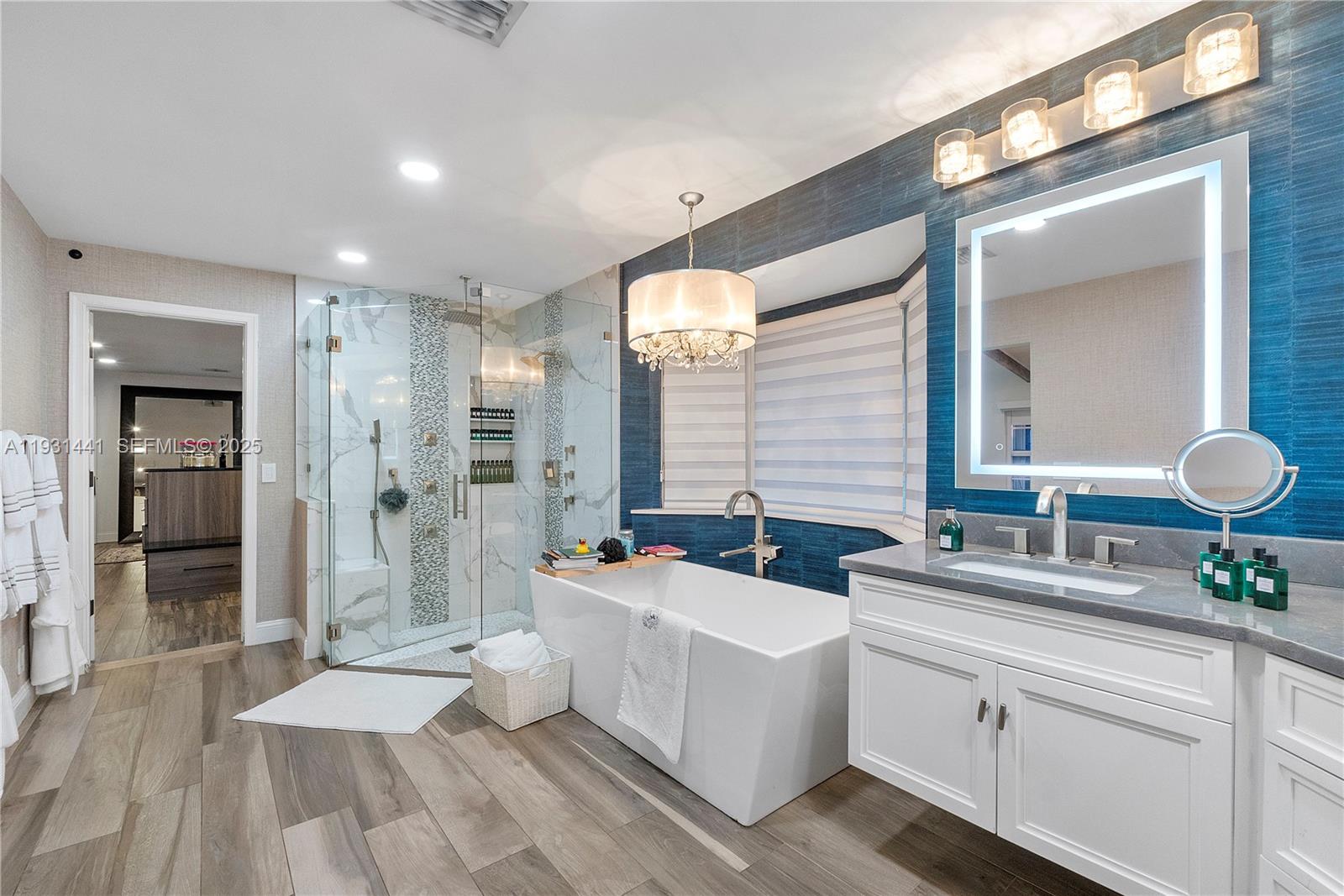 8020 Northwest 47th Drive Coral Springs, FL 33067 - Photo 55 of 83 a spacious bathroom with double vanity and a shower