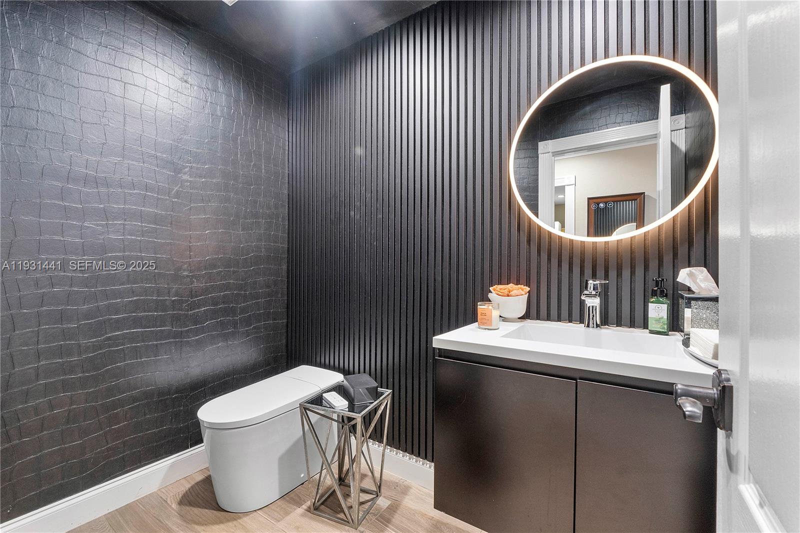 8020 Northwest 47th Drive Coral Springs, FL 33067 - Photo 72 of 83 a bathroom with a toilet a sink and mirror