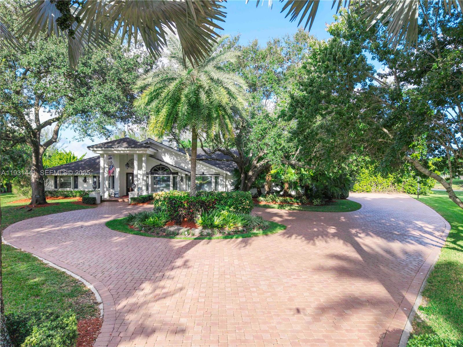 8020 Northwest 47th Drive Coral Springs, FL 33067 - Photo 79 of 83 a view of a street with a building and palm trees