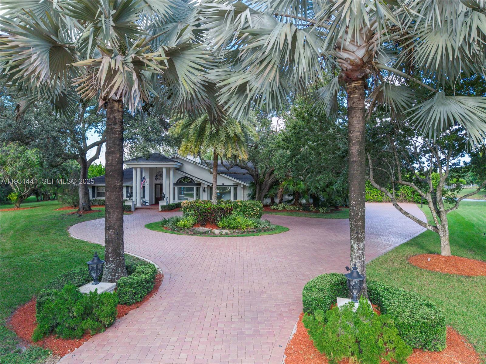 8020 Northwest 47th Drive Coral Springs, FL 33067 - Photo 83 of 83 a front view of a house with garden