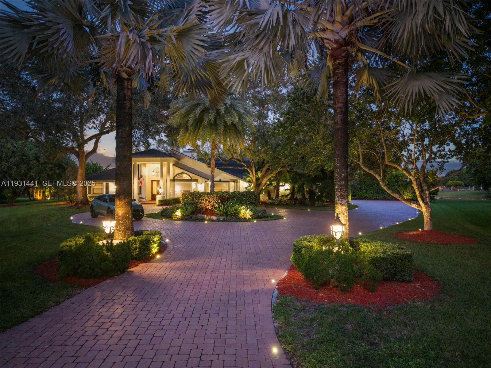 8020 Northwest 47th Drive Coral Springs, FL 33067 - Photo 10 of 83 a view of a yard with plants and trees