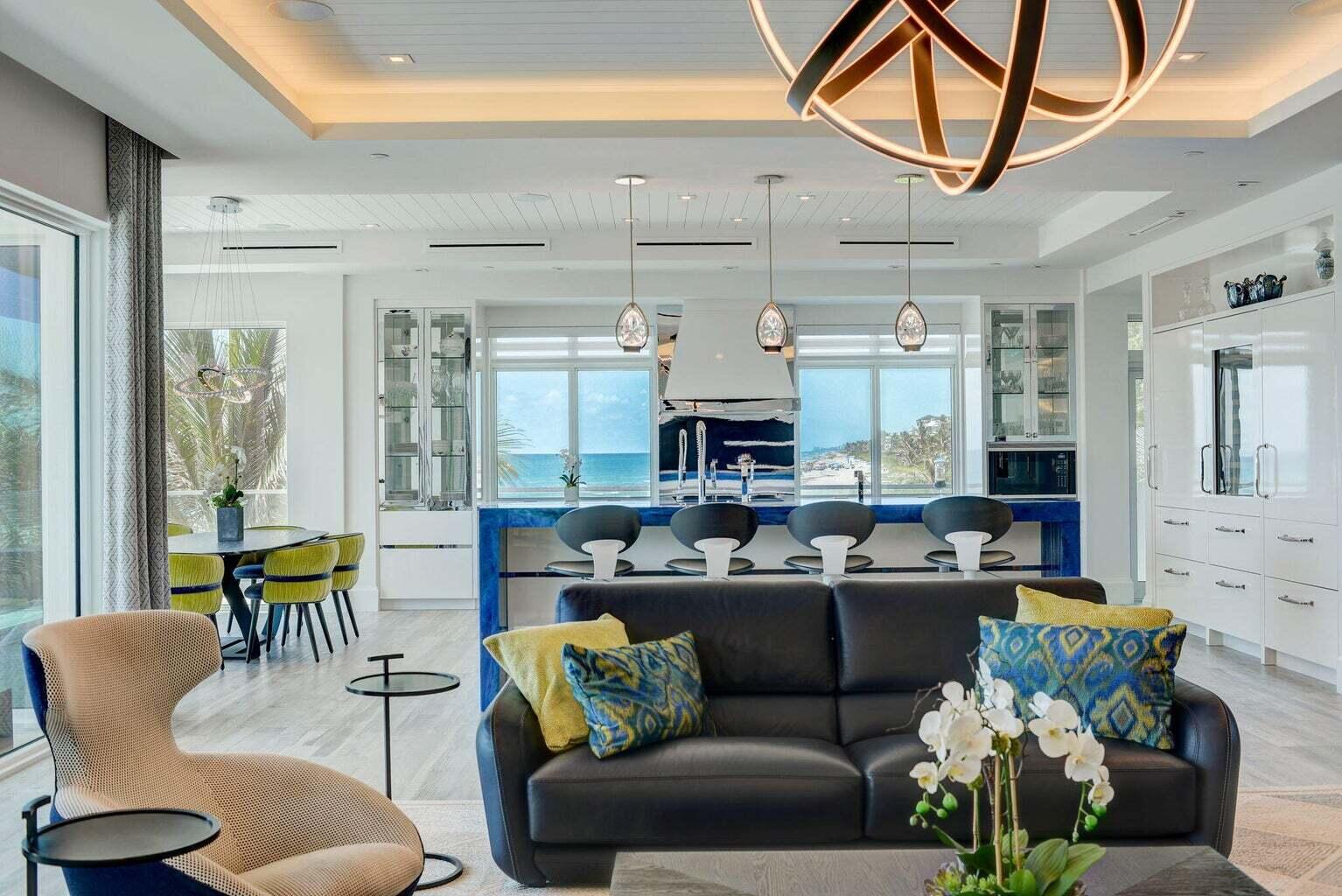 5001 Old Ocean Boulevard Ocean Ridge, FL 33435 - Photo 13 of 66 a living room with furniture and a chandelier