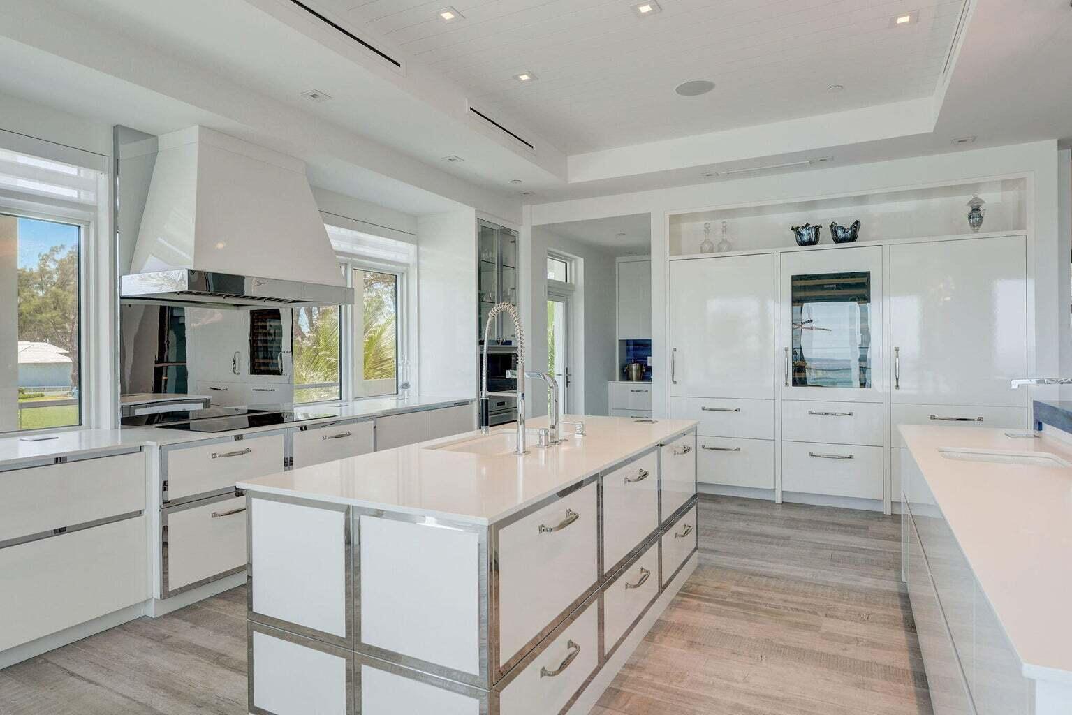 5001 Old Ocean Boulevard Ocean Ridge, FL 33435 - Photo 18 of 66 a large white kitchen with cabinets