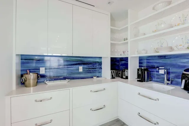 a dining room with furniture and a mirror