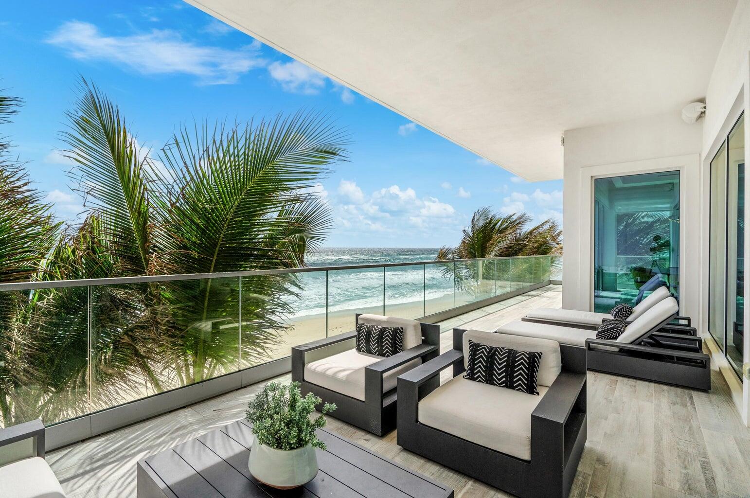 5001 Old Ocean Boulevard Ocean Ridge, FL 33435 - Photo 27 of 66 a view of a patio with couches chairs and a potted plant