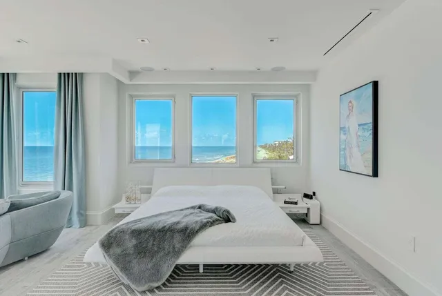 a bathroom with a tub sink shower and mirror