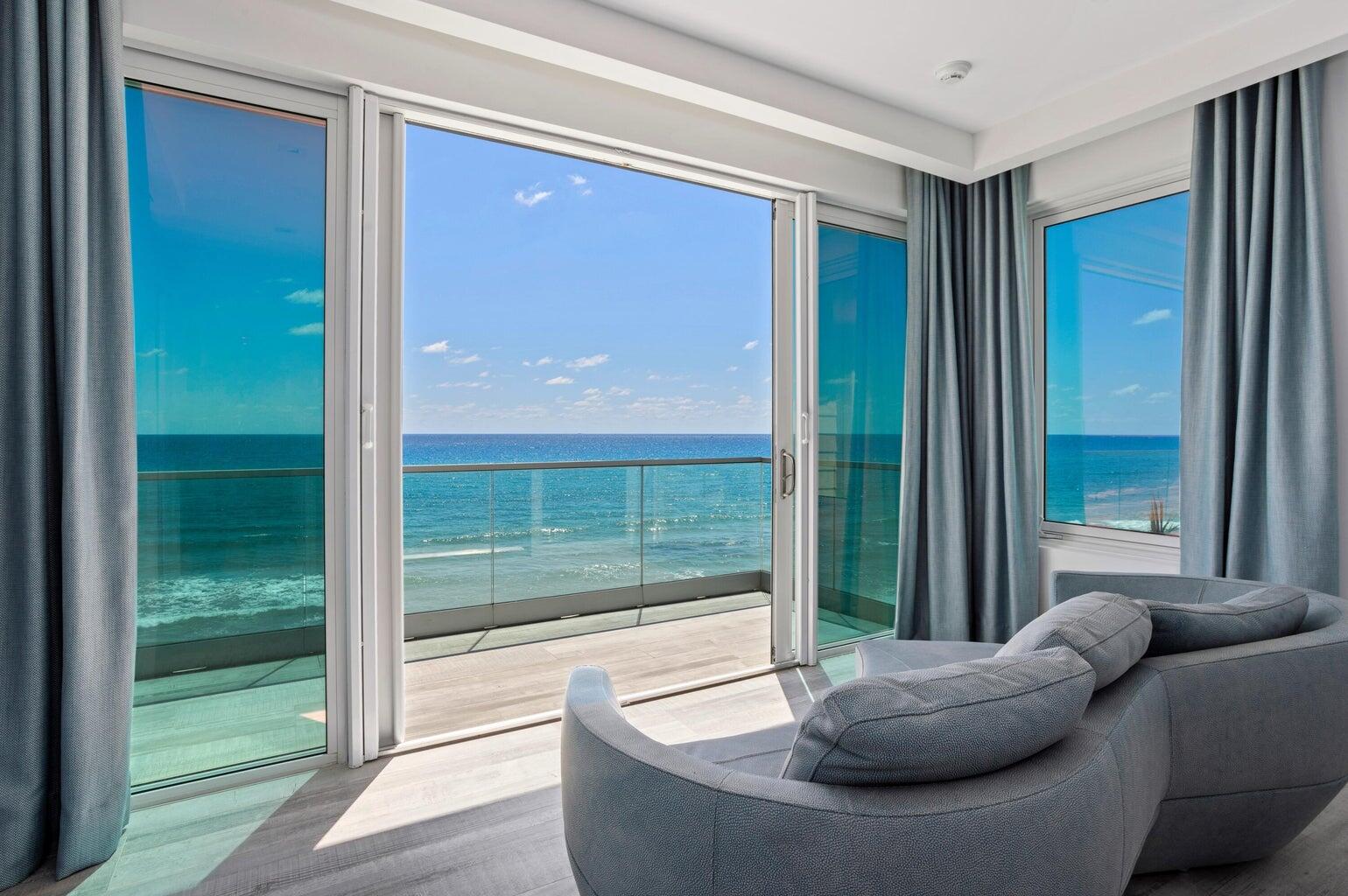 5001 Old Ocean Boulevard Ocean Ridge, FL 33435 - Photo 37 of 66 a living room with couch and a floor to ceiling window