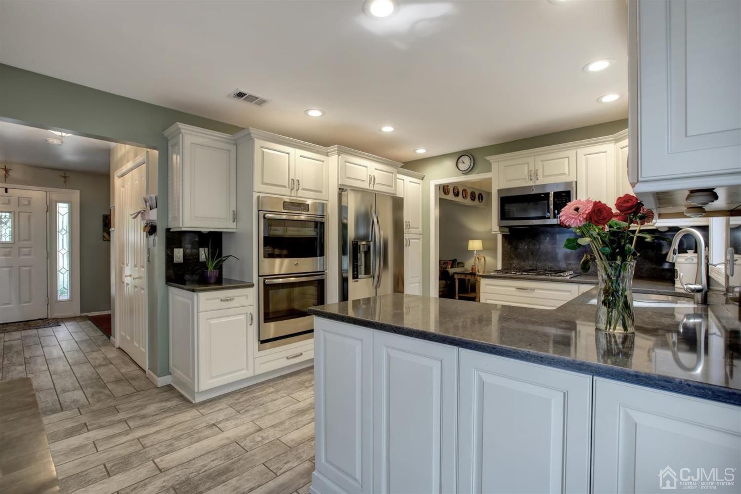 11 Walnut Court Old Bridge, NJ 07747 - Photo 12 of 32 a kitchen with sink and refrigerator