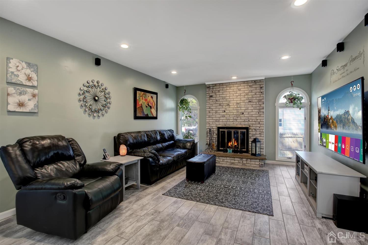 11 Walnut Court Old Bridge, NJ 07747 - Photo 15 of 32 a living room with furniture and a fireplace