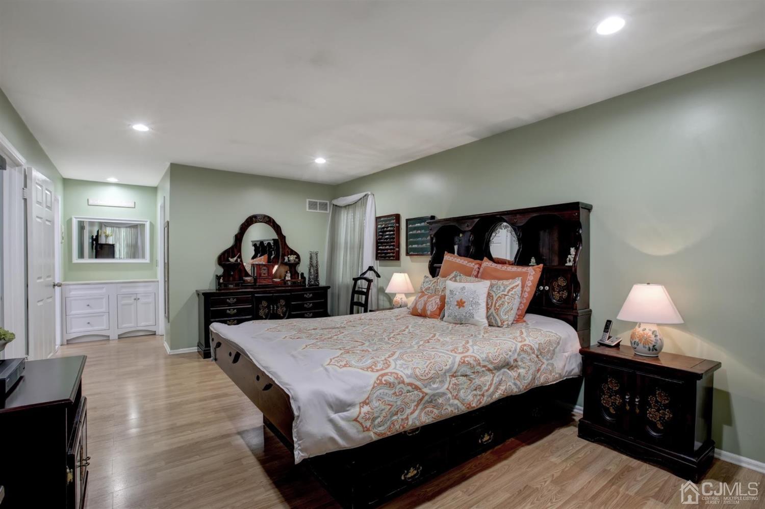 11 Walnut Court Old Bridge, NJ 07747 - Photo 18 of 32 a bedroom with a bed and a lamp