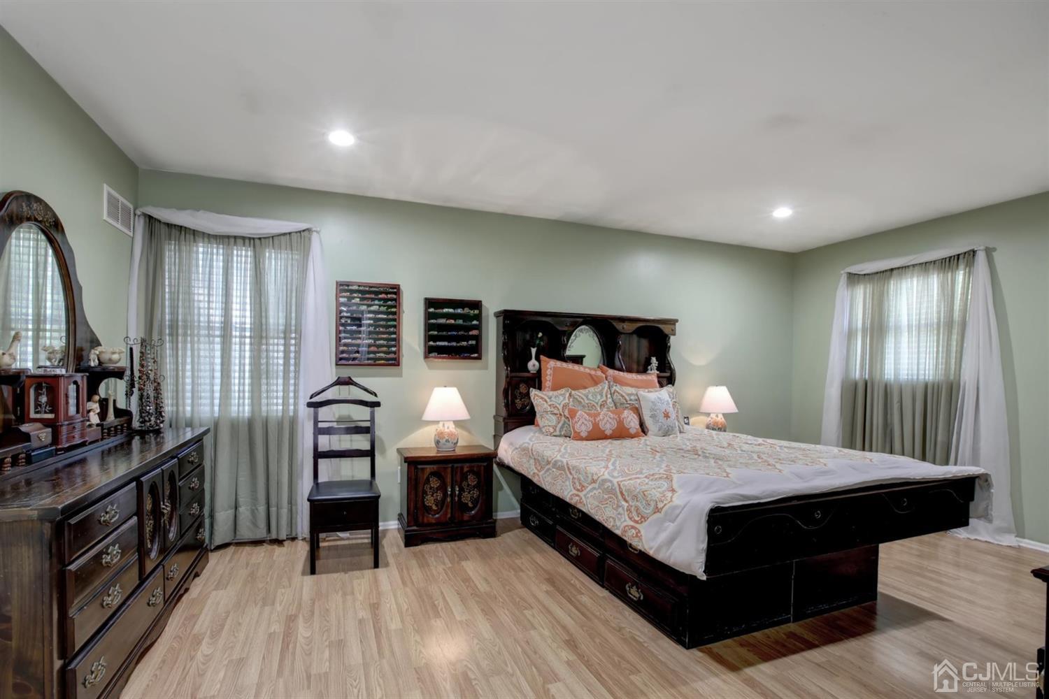 11 Walnut Court Old Bridge, NJ 07747 - Photo 19 of 32 a bedroom with bed and wooden floor