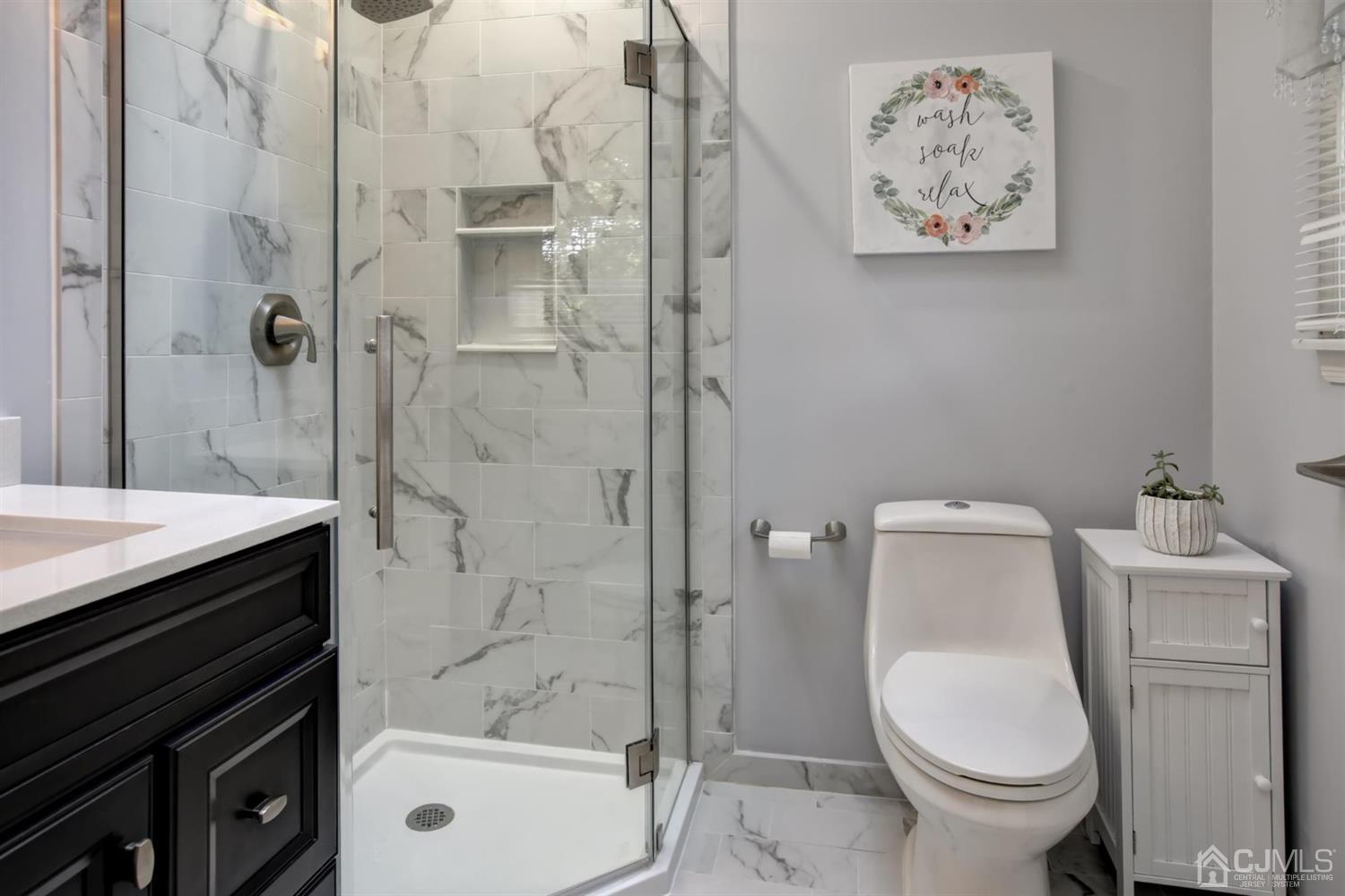 11 Walnut Court Old Bridge, NJ 07747 - Photo 20 of 32 a bathroom with a toilet and a sink