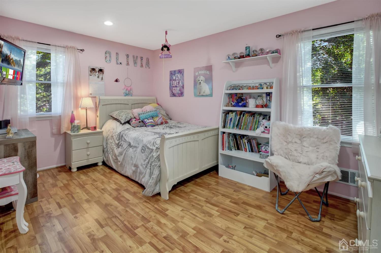 11 Walnut Court Old Bridge, NJ 07747 - Photo 24 of 32 a bedroom with a bed wooden floor and a book shelf
