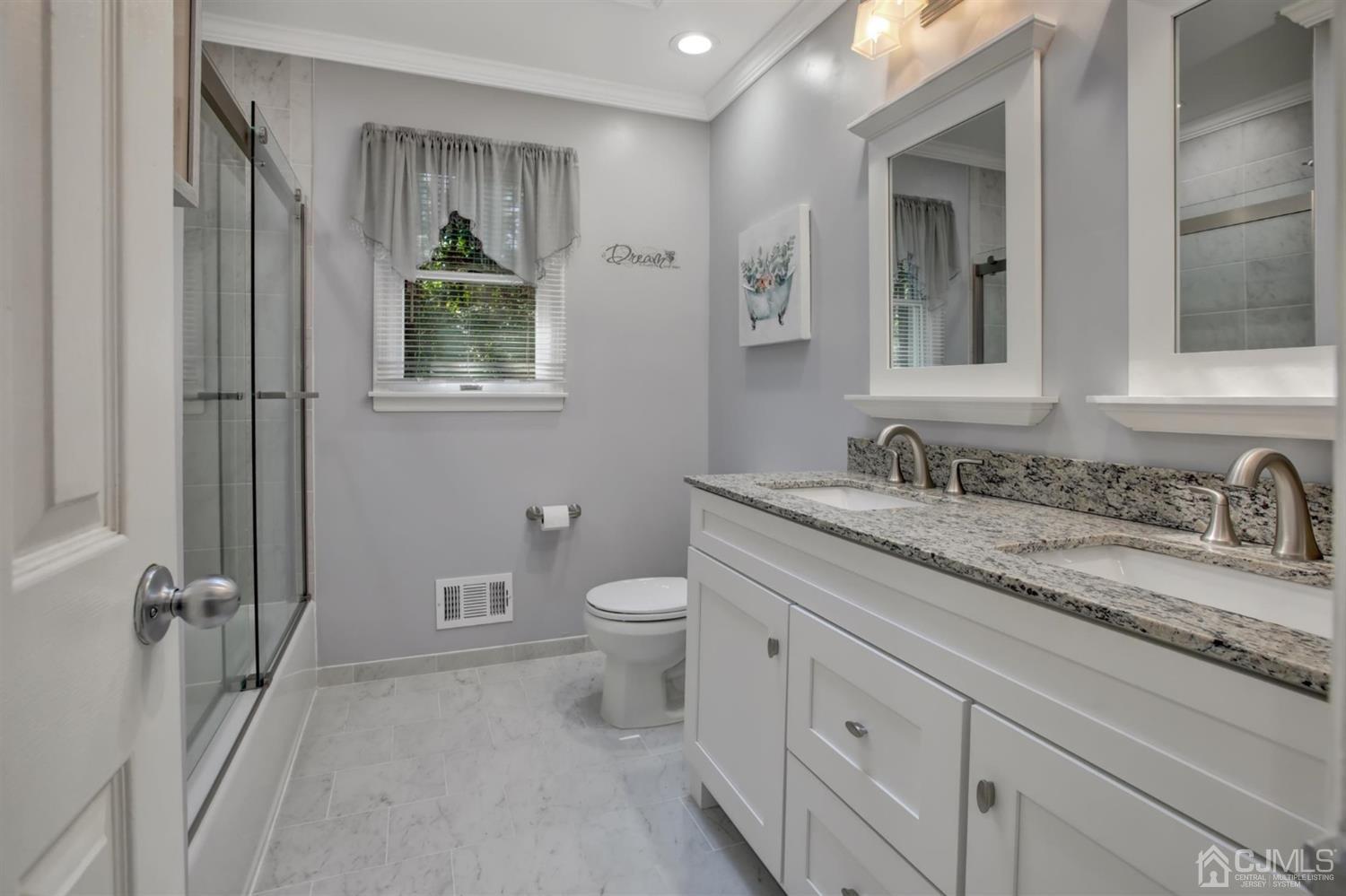 11 Walnut Court Old Bridge, NJ 07747 - Photo 25 of 32 a bathroom with a granite countertop sink toilet and mirror