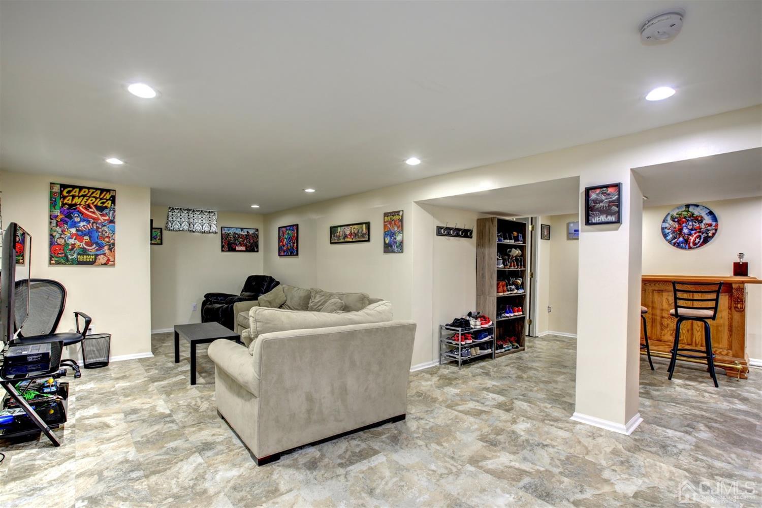 11 Walnut Court Old Bridge, NJ 07747 - Photo 26 of 32 a living room with furniture and a gym machine