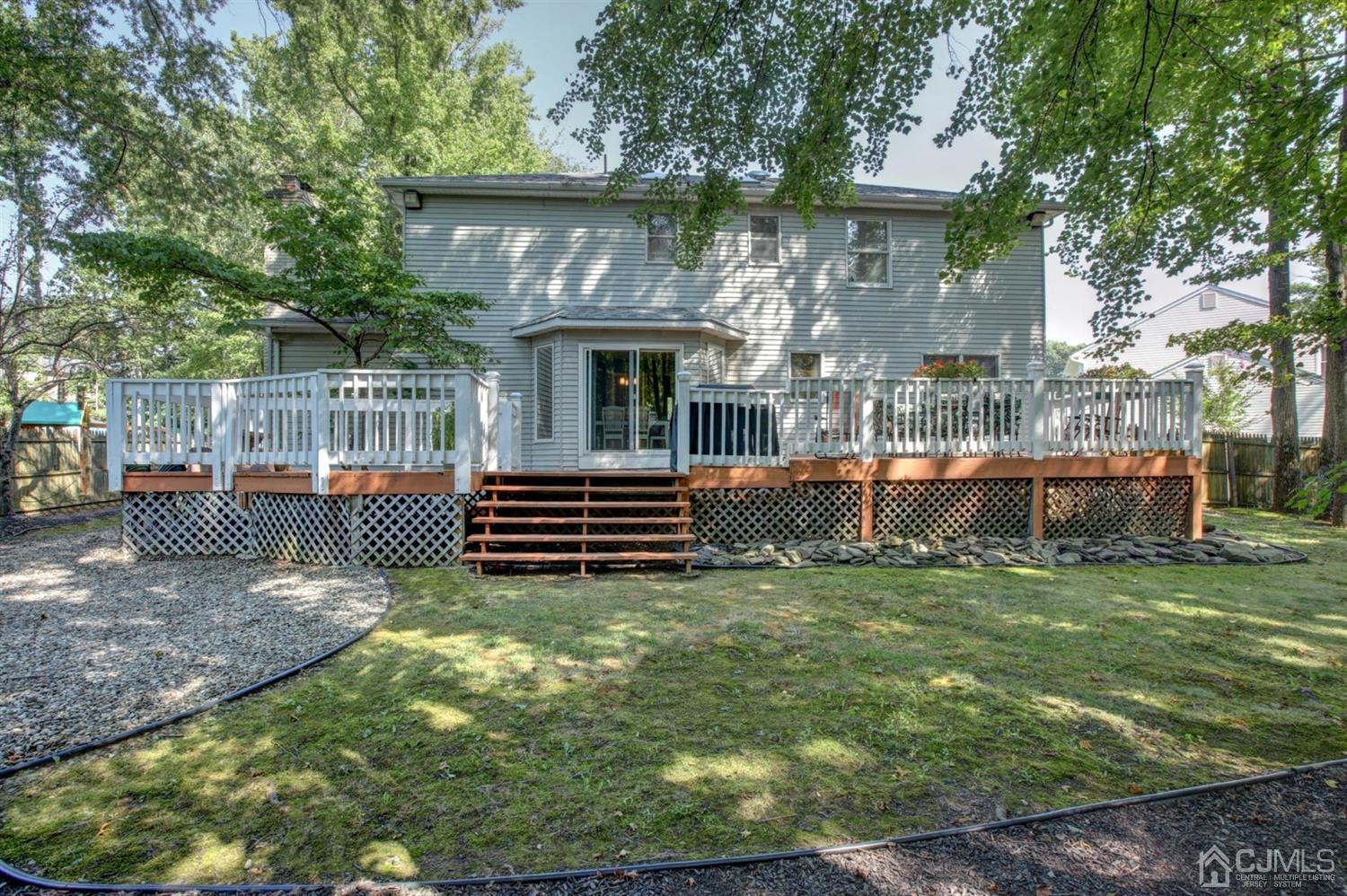 11 Walnut Court Old Bridge, NJ 07747 - Photo 28 of 32 a backyard of a house with sofas table and chairs