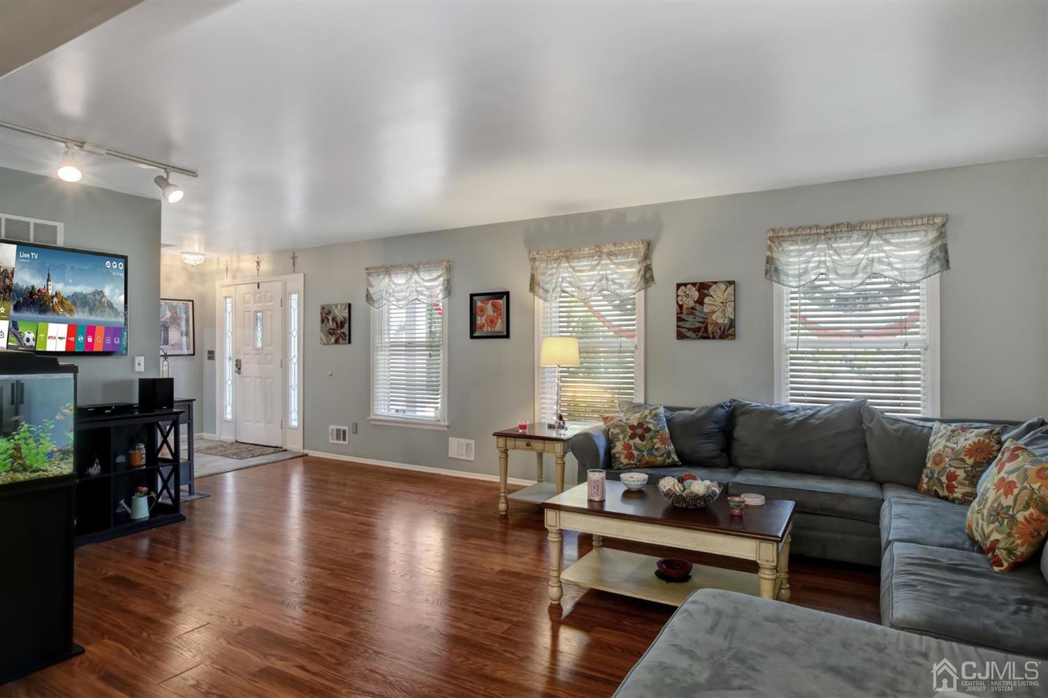 11 Walnut Court Old Bridge, NJ 07747 - Photo 7 of 32 a living room with furniture and a fireplace