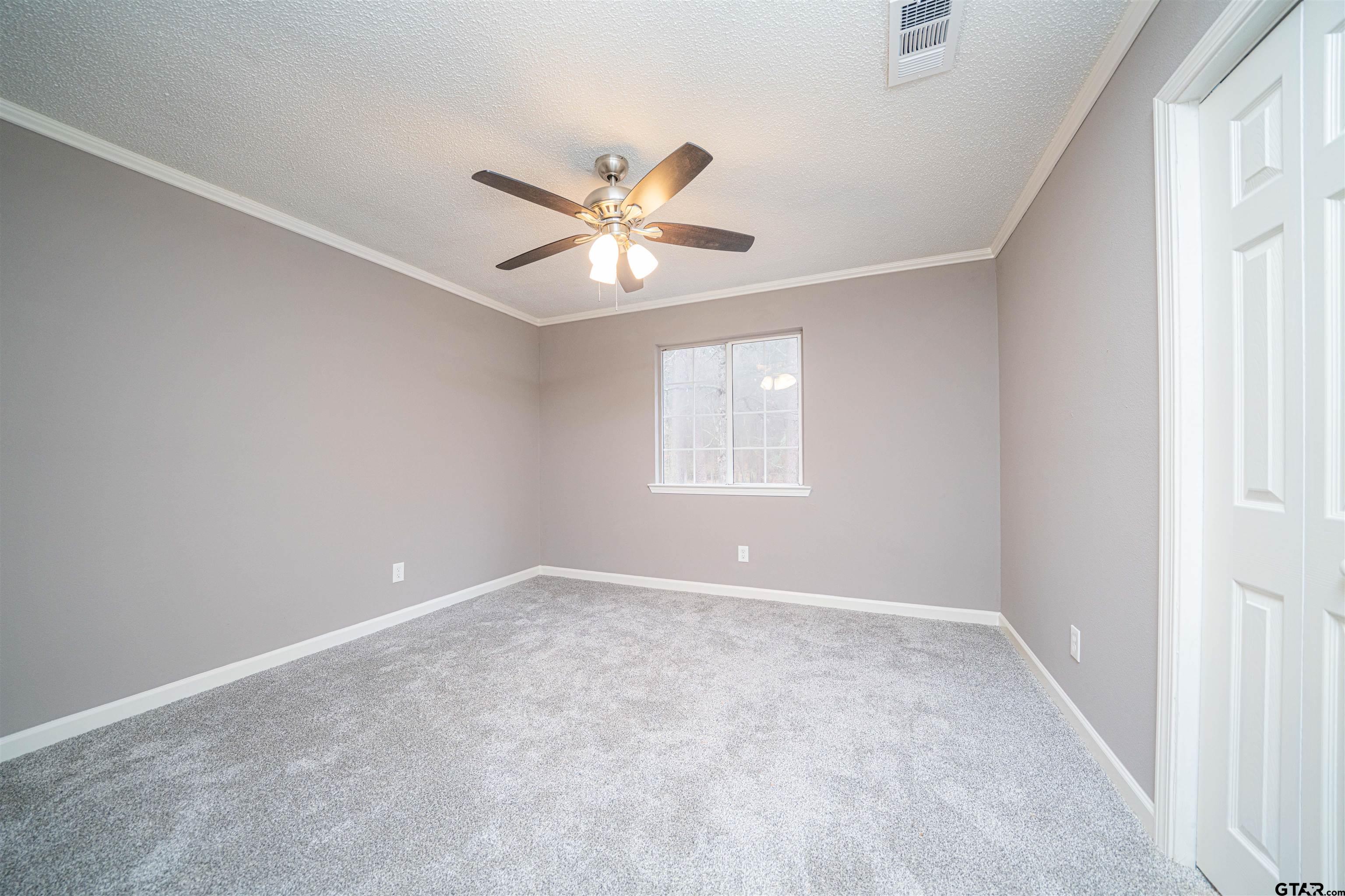 2802 Granite Drive Longview, TX 75604 - Photo 7 of 19 a view of an empty room with a window