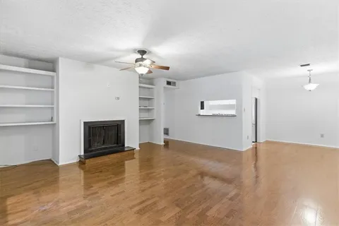 a view of empty room with a fireplace