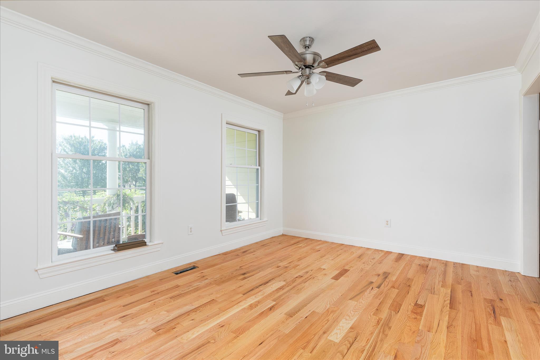 1200 Salem Church Road Stephens City, VA 22655 - Photo 6 of 69 a view of a big room with wooden floor and windows