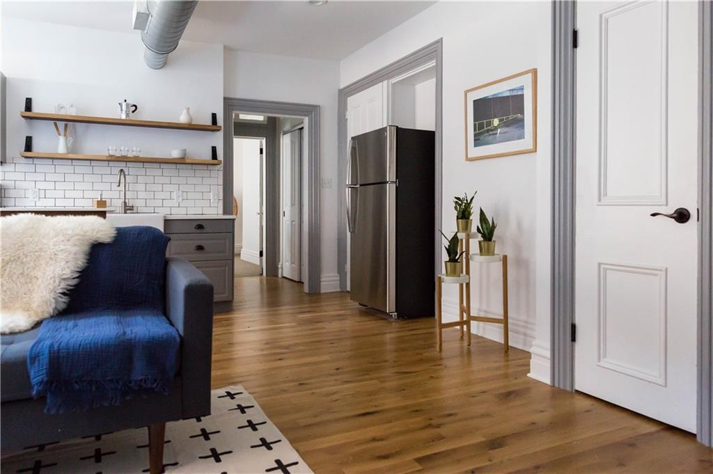 4407 Butler Street Pittsburgh, PA 15201 - Photo 15 of 29 a view of kitchen with stainless steel appliances granite countertop a refrigerator and a stove top oven