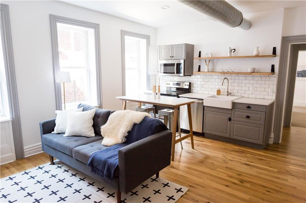 4407 Butler Street Pittsburgh, PA 15201 - Photo 17 of 29 a living room with stainless steel appliances kitchen island granite countertop a sink and a cabinets