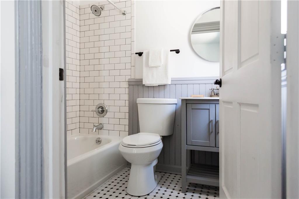 4407 Butler Street Pittsburgh, PA 15201 - Photo 18 of 29 a bathroom with a toilet and a sink