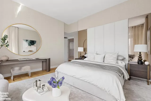a view of dining table chairs and window in a room