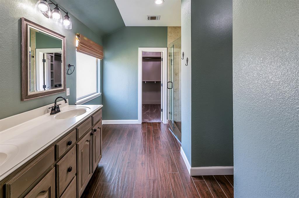 1070 Shepard Lane Lavon, TX 75166 - Photo 18 of 29 a bathroom with a sink and a mirror