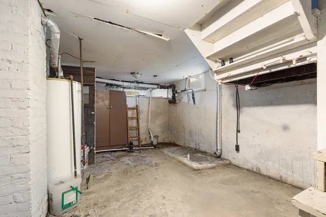 a view of a field with trees in the background